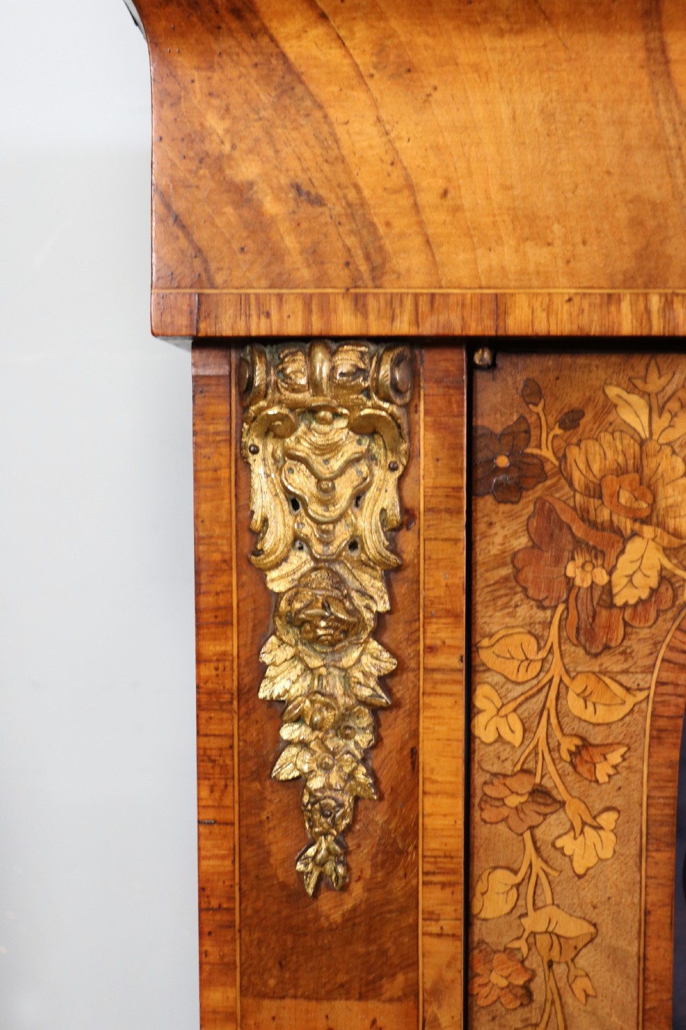 A lovely Victorian walnut and floral inlaid pier cabinet, later sign written in French with Champagne advertising. View X