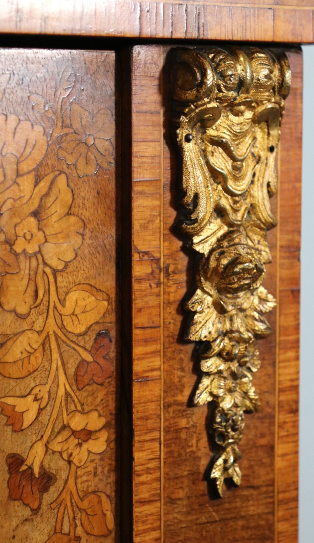A lovely Victorian walnut and floral inlaid pier cabinet, later sign written in French with Champagne advertising. View XII
