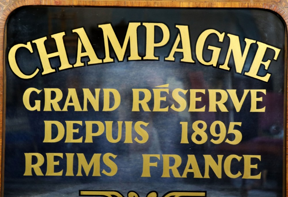 A lovely Victorian walnut and floral inlaid pier cabinet, later sign written in French with Champagne advertising. View XVI