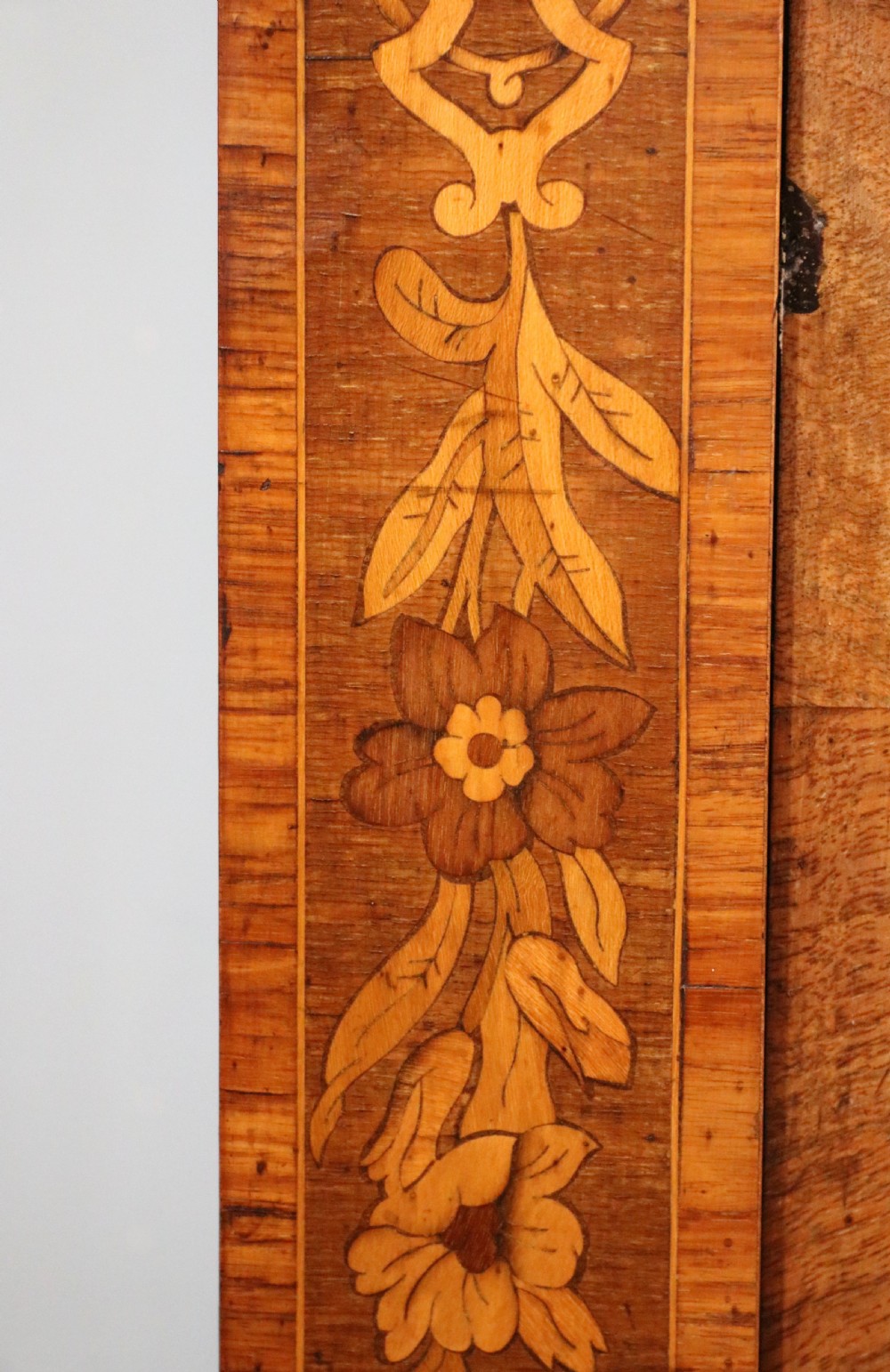 A lovely Victorian walnut and floral inlaid pier cabinet, later sign written in French with Champagne advertising. View XVIII