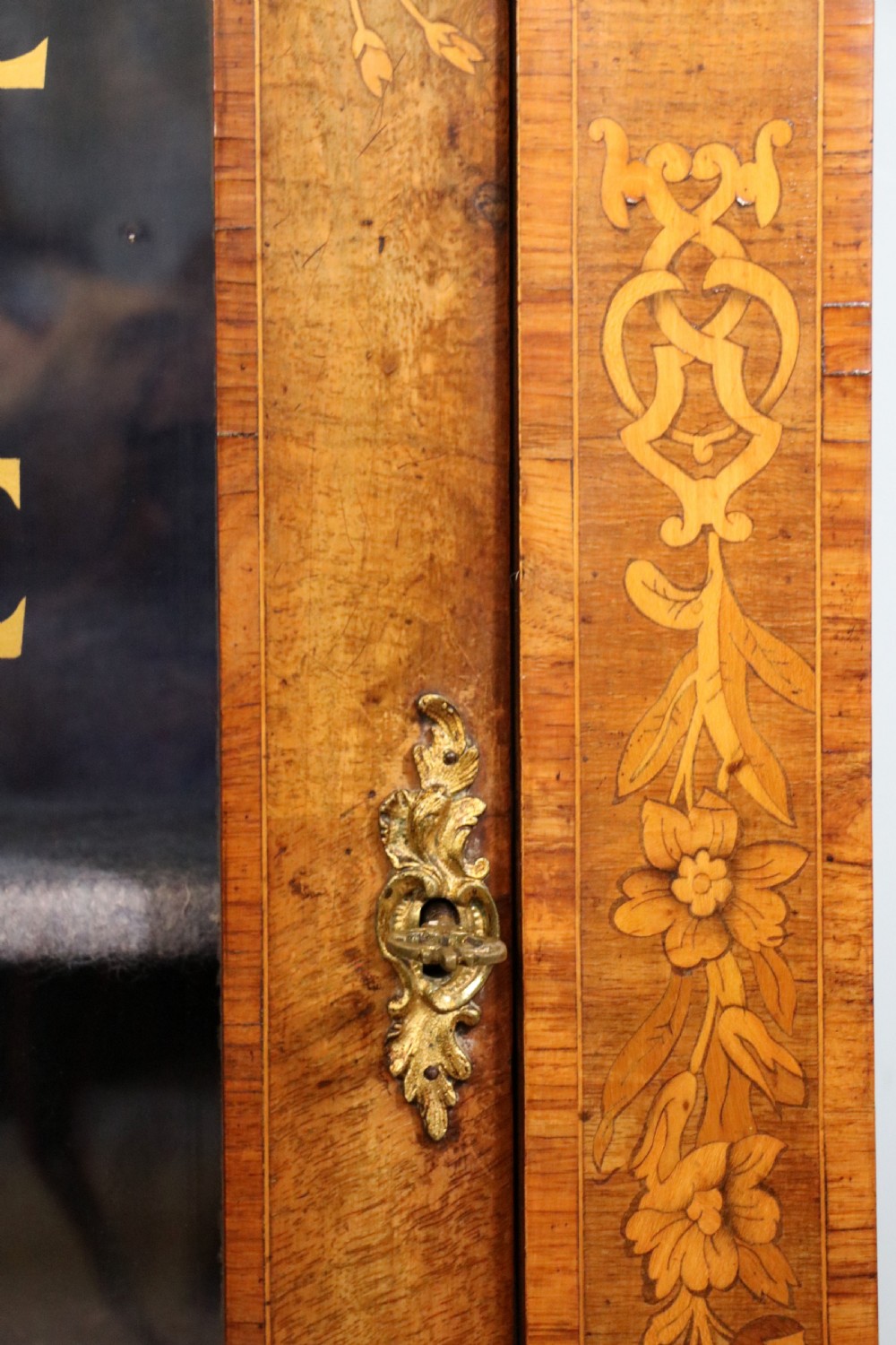 A lovely Victorian walnut and floral inlaid pier cabinet, later sign written in French with Champagne advertising. View XXI