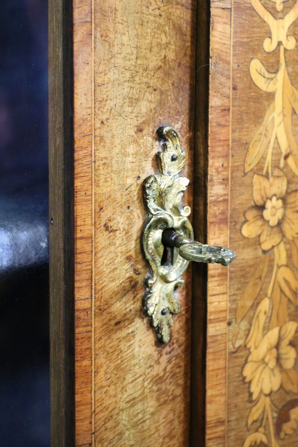 A lovely Victorian walnut and floral inlaid pier cabinet, later sign written in French with Champagne advertising. View XXII