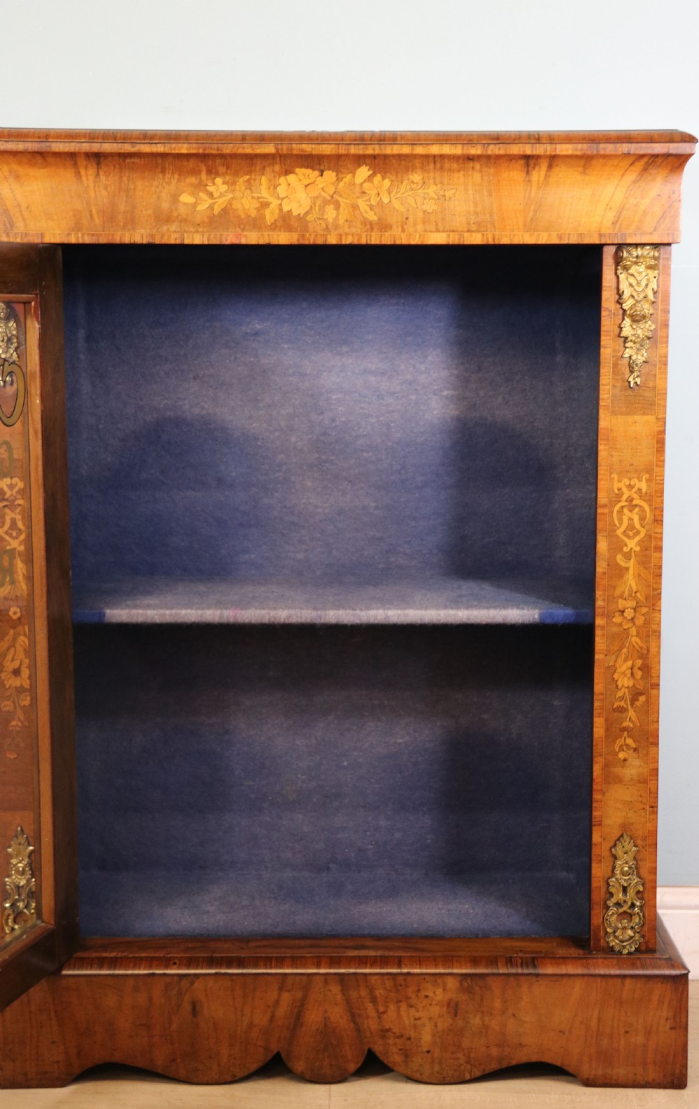 A lovely Victorian walnut and floral inlaid pier cabinet, later sign written in French with Champagne advertising. View XXIII