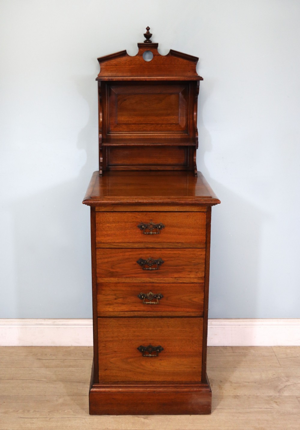 A late 19th century American walnut pedestal chest.
