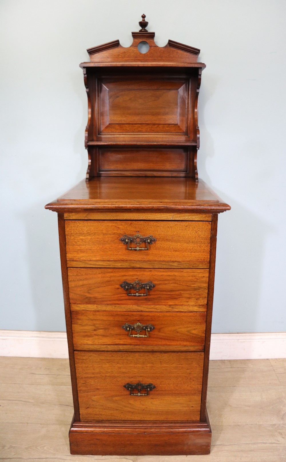 A late 19th century American walnut pedestal chest. View II