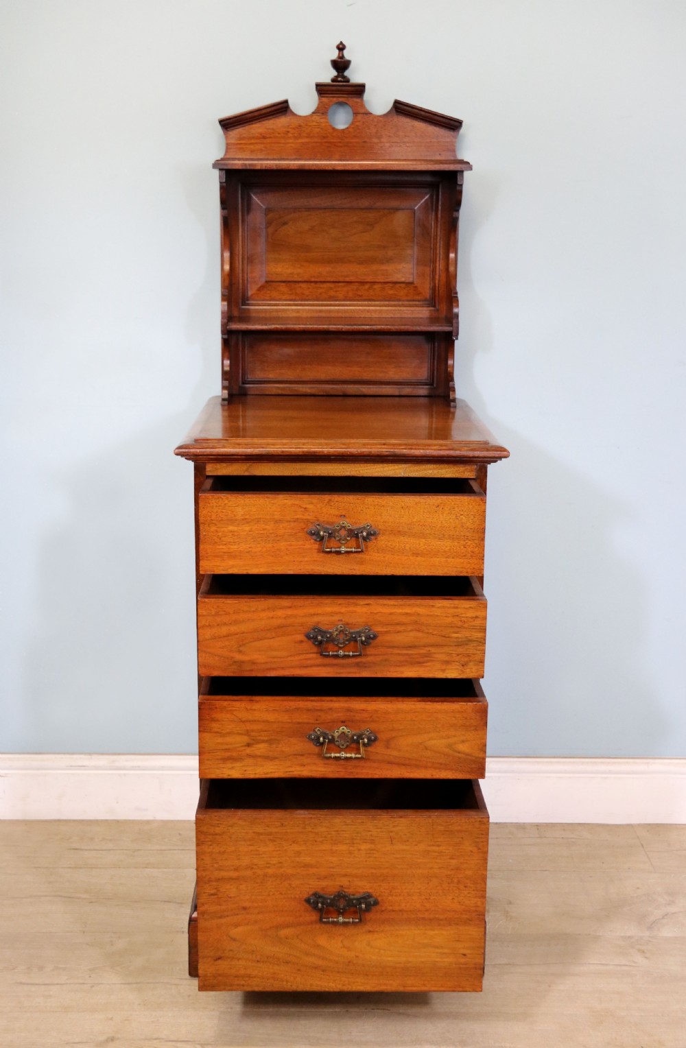 A late 19th century American walnut pedestal chest. View III
