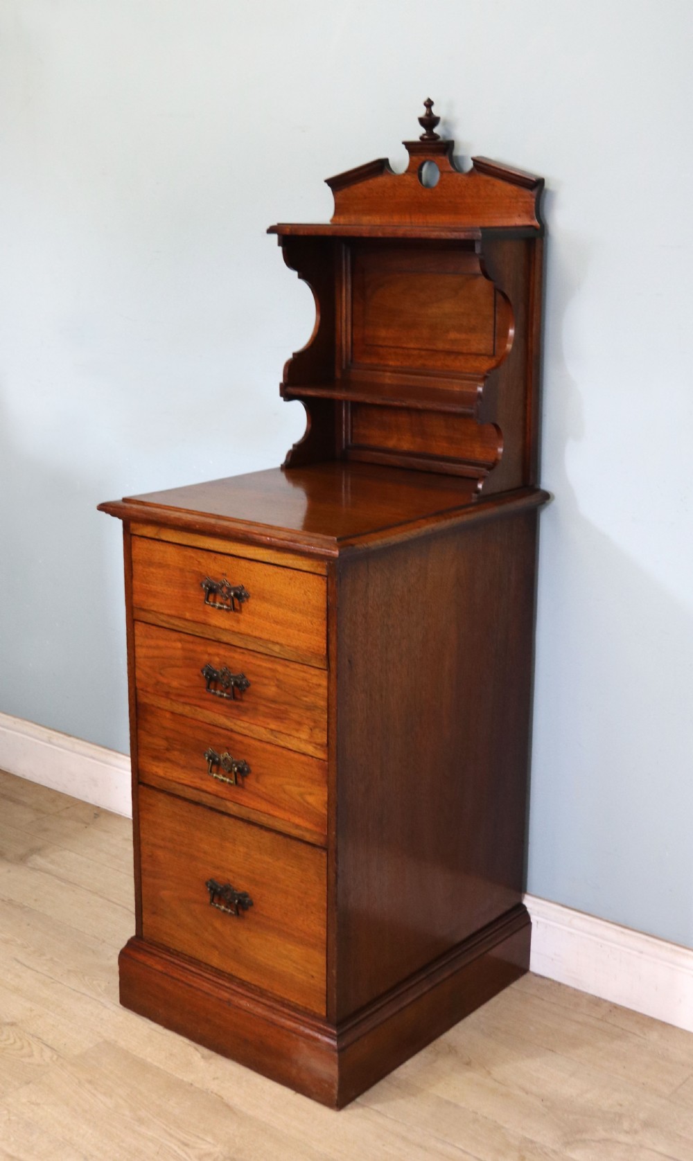 A late 19th century American walnut pedestal chest. View VI