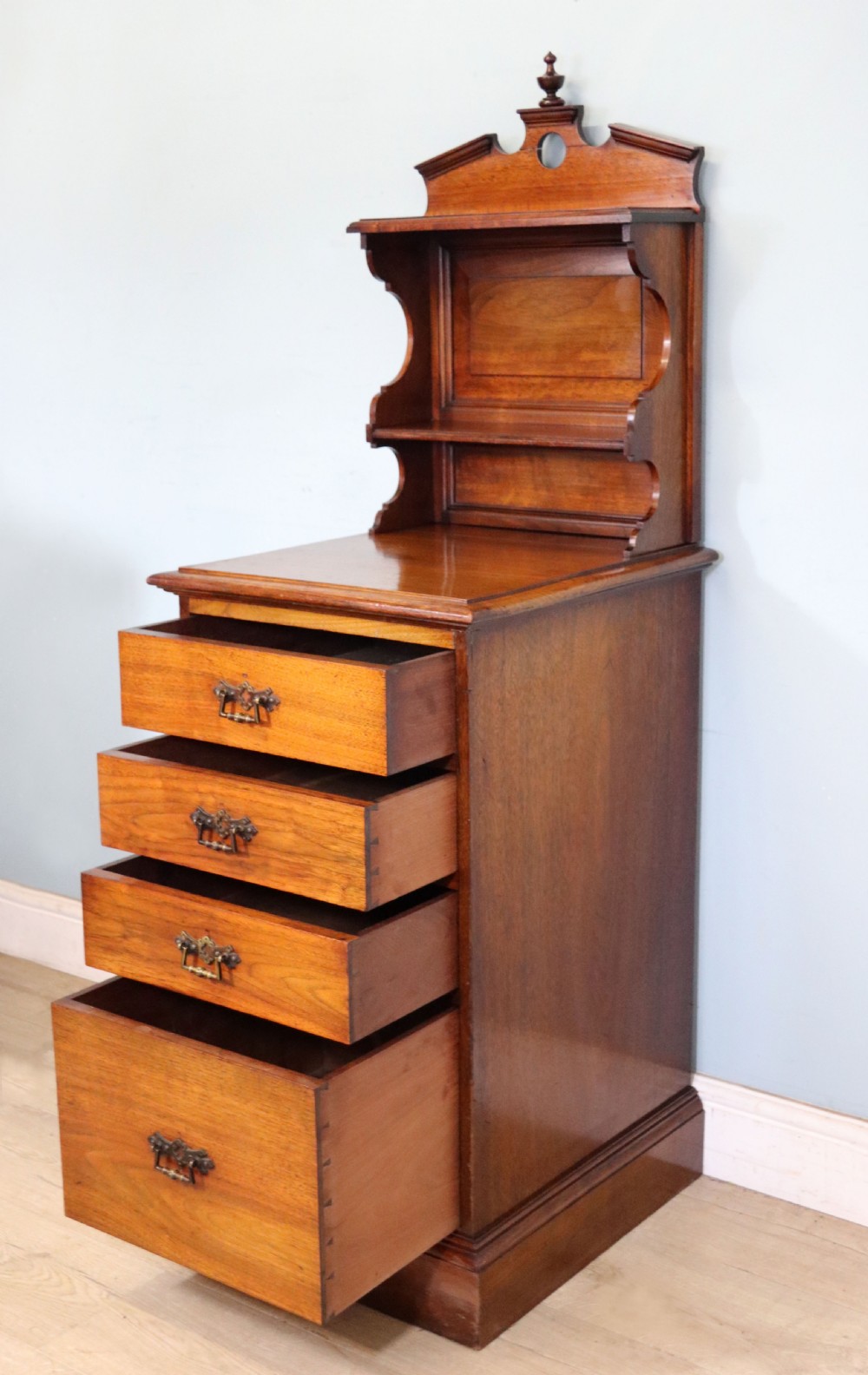 A late 19th century American walnut pedestal chest. View VII