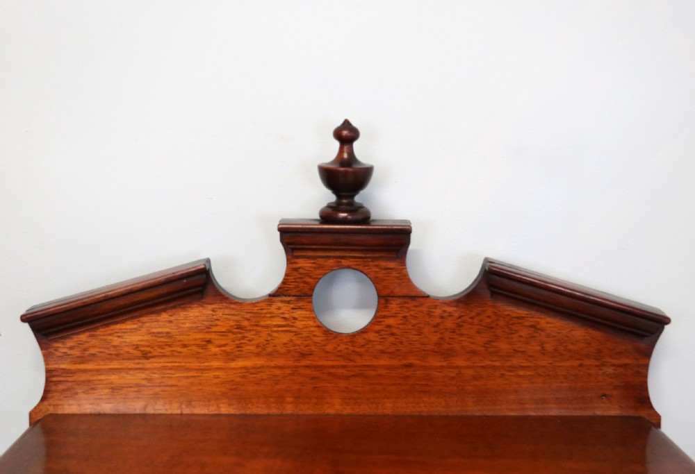A late 19th century American walnut pedestal chest. View IX