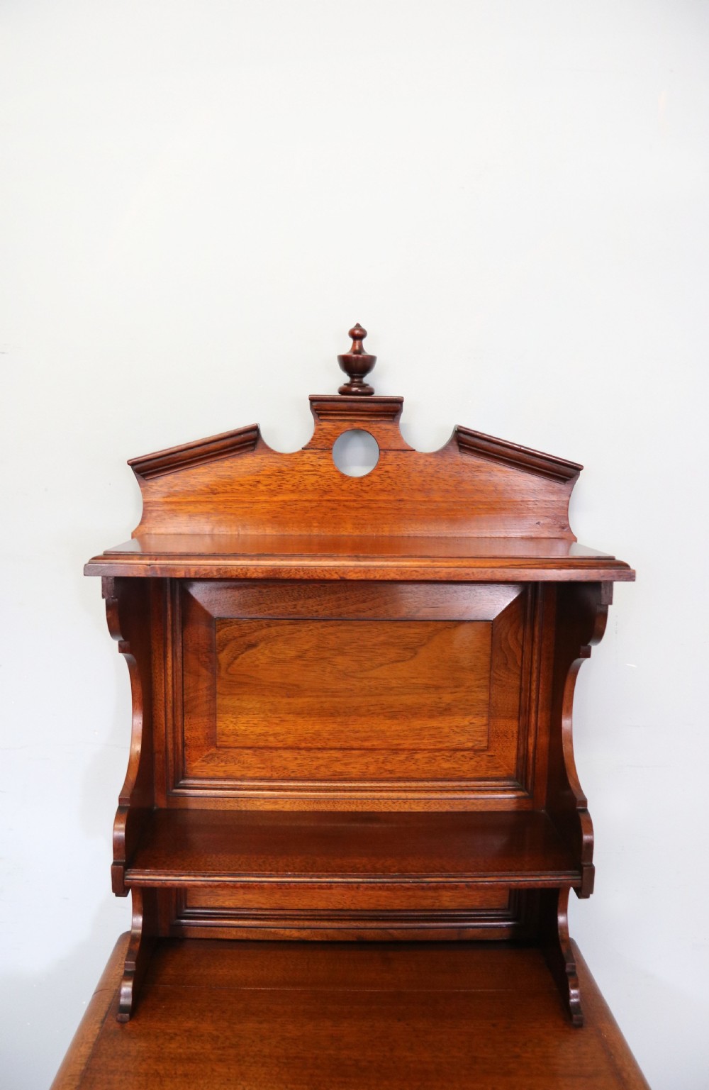 A late 19th century American walnut pedestal chest. View XI