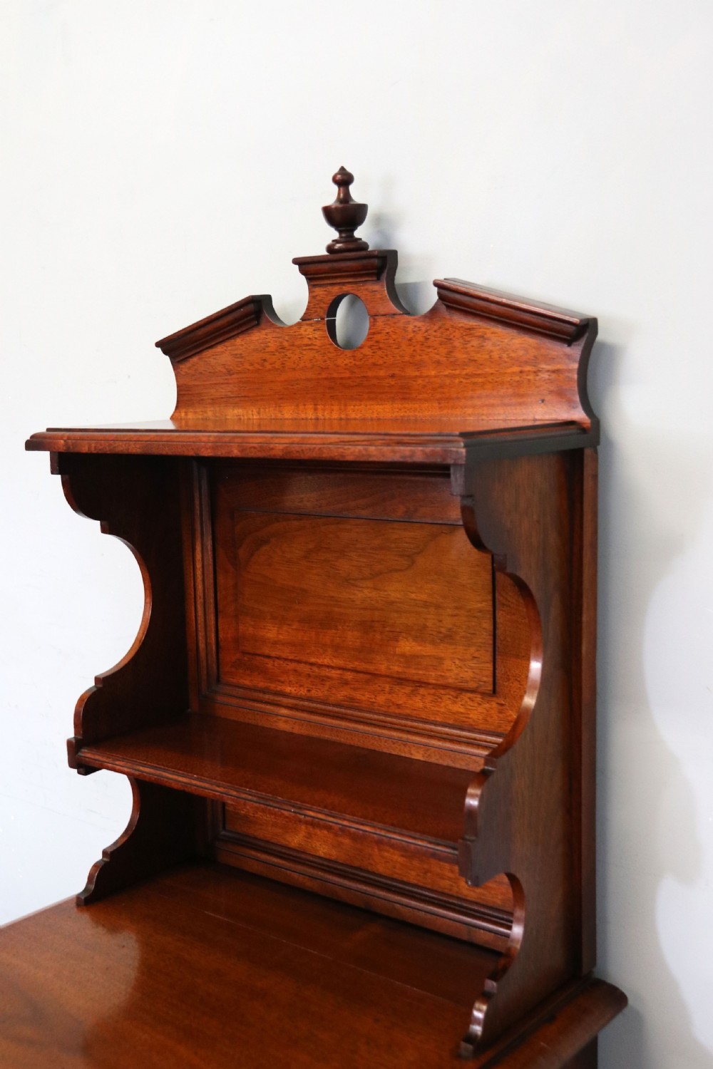 A late 19th century American walnut pedestal chest. View XII
