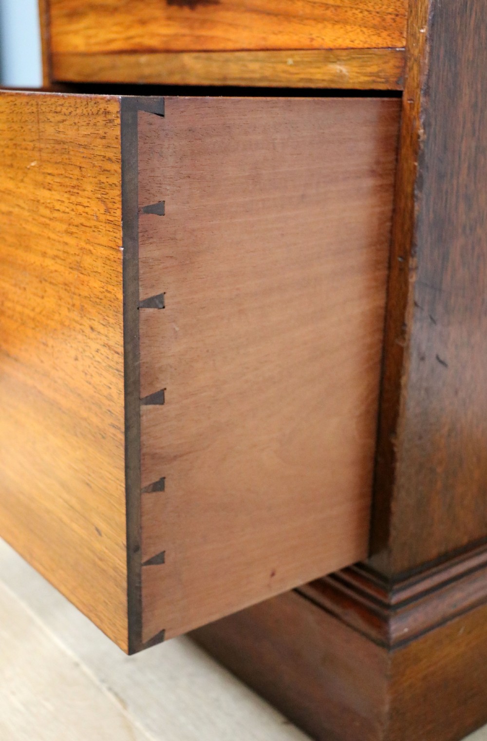 A late 19th century American walnut pedestal chest. View XIX