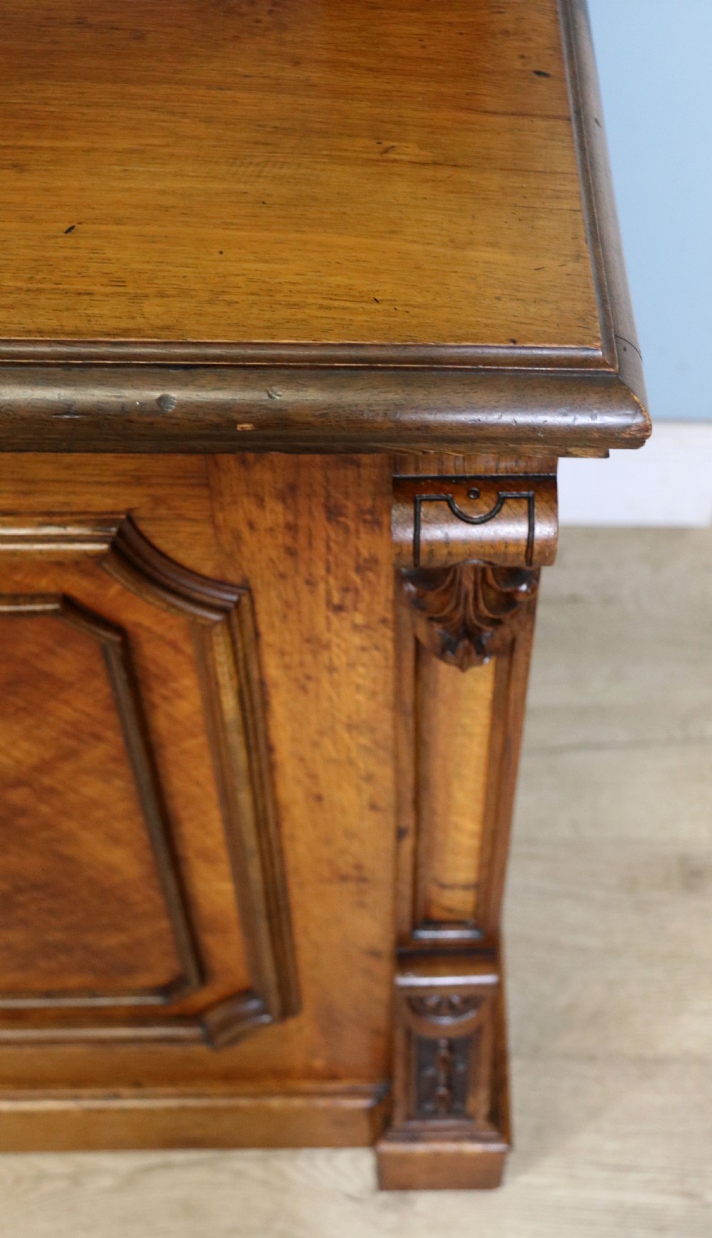 A Victorian pollard oak sideboard featuring a carved upper display shelf, fretwork cresting, and two fielded panel doors with decorative wood grain. View XXVIII