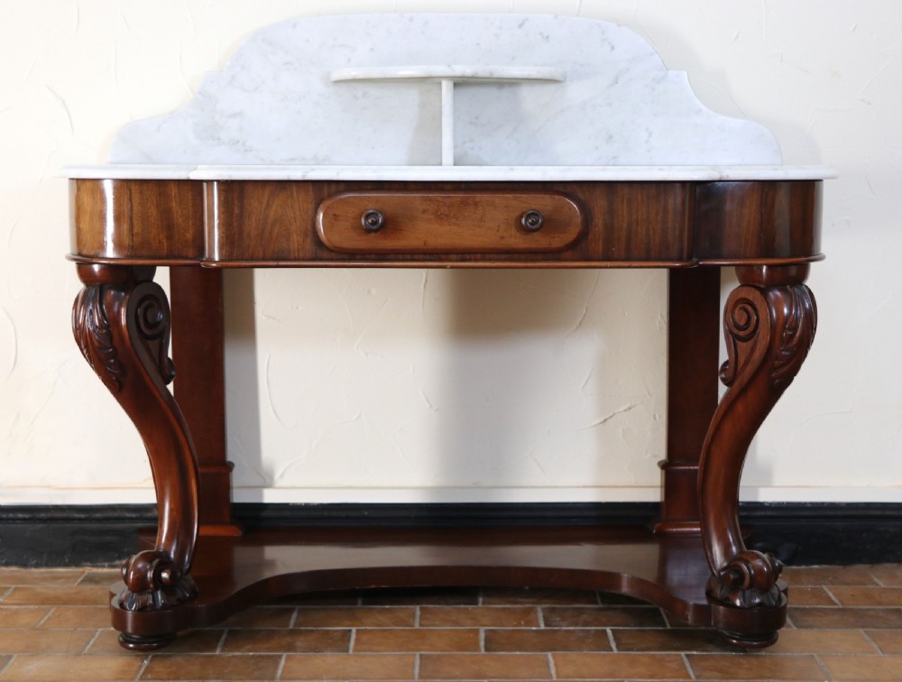  A lovely London Victorian duchess washstand has a marble top.