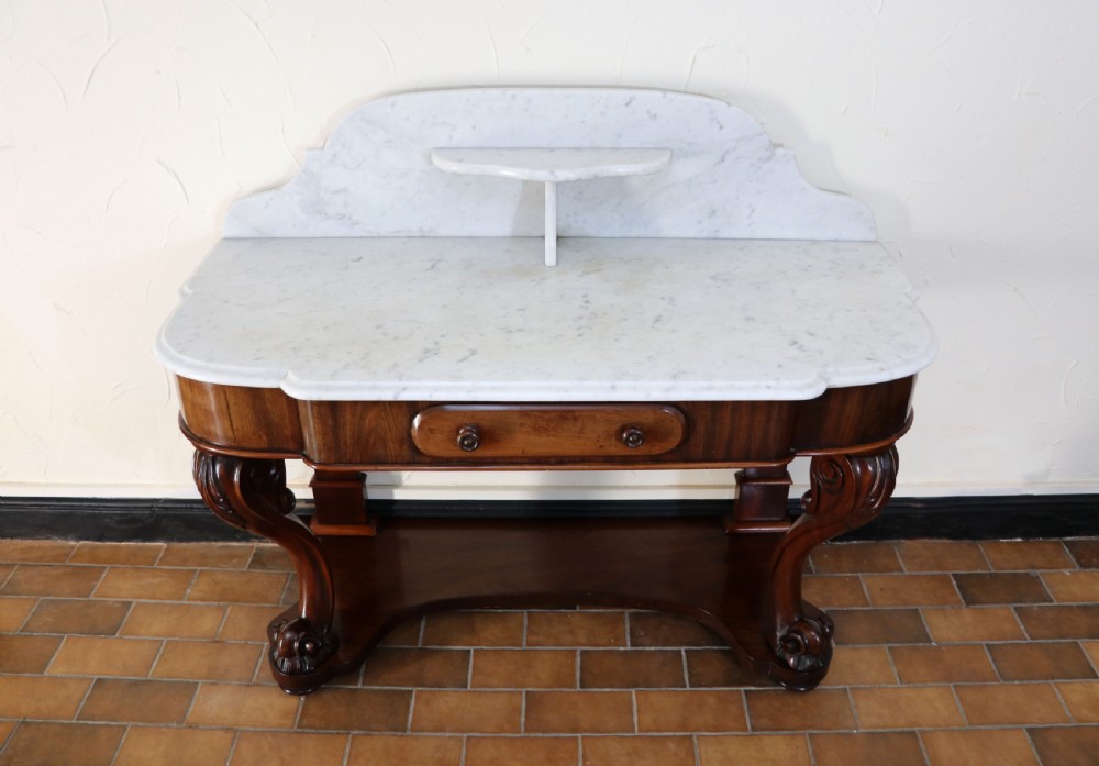  A lovely London Victorian duchess washstand has a marble top. View III