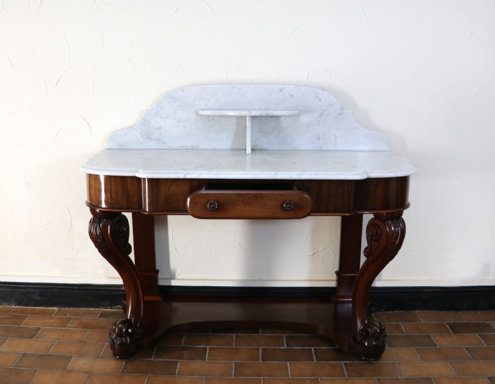  A lovely London Victorian duchess washstand has a marble top. View IV