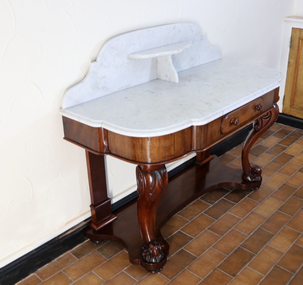  A lovely London Victorian duchess washstand has a marble top. View VI