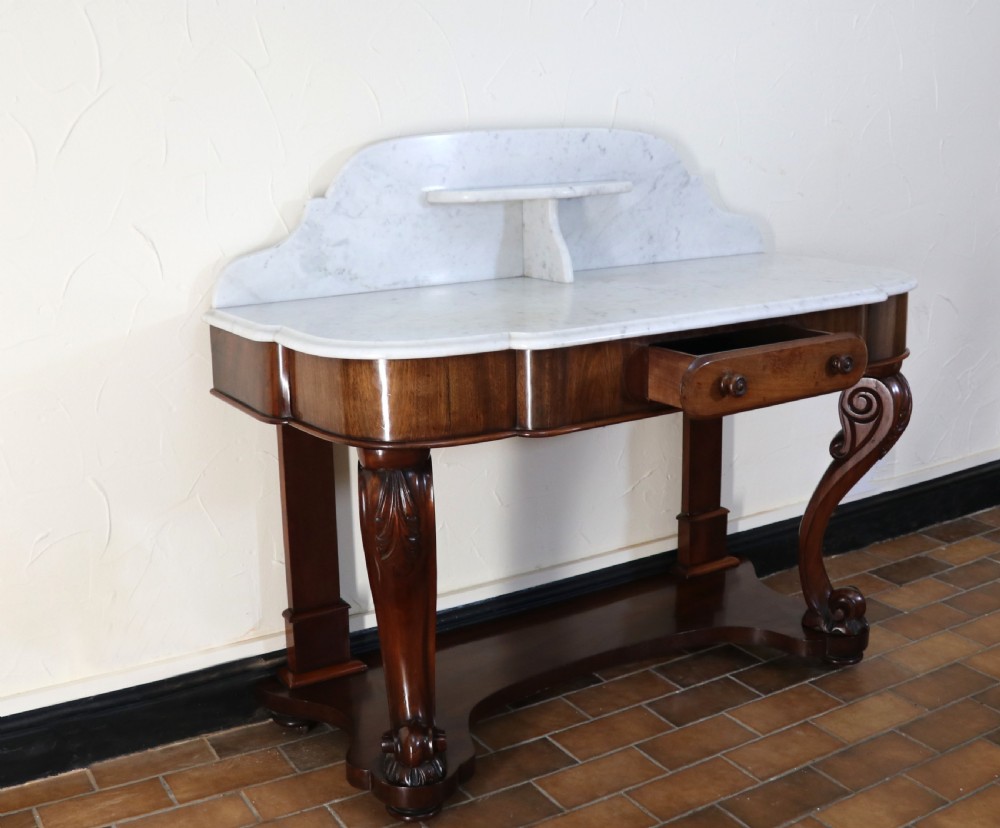  A lovely London Victorian duchess washstand has a marble top. View VII