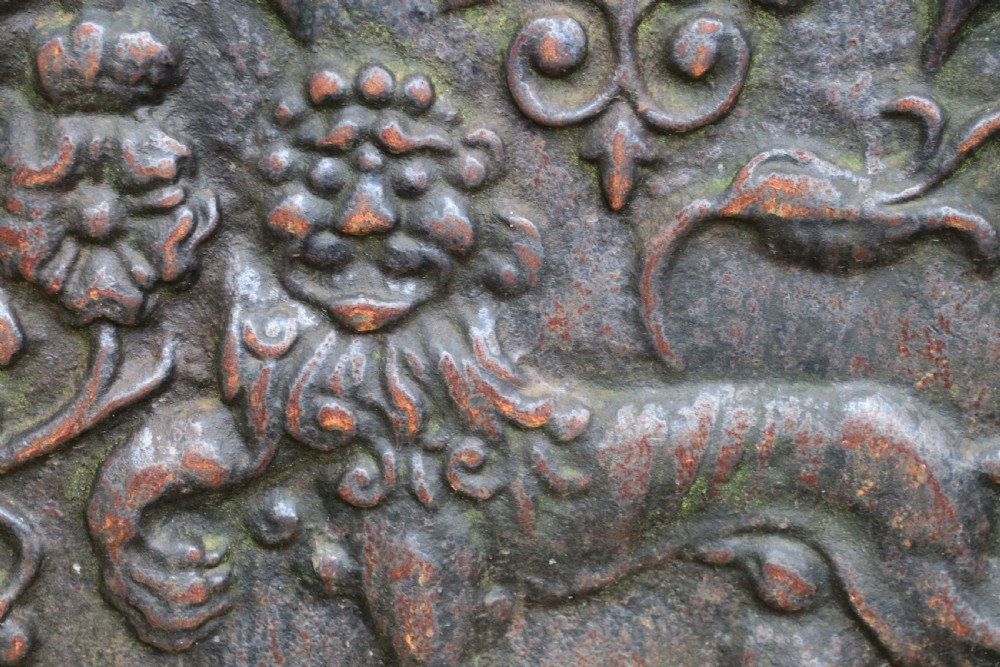 A cast iron fire back in the medieval style with passant guardant leopard. View V