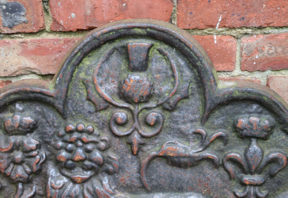 A cast iron fire back in the medieval style with passant guardant leopard. View VI