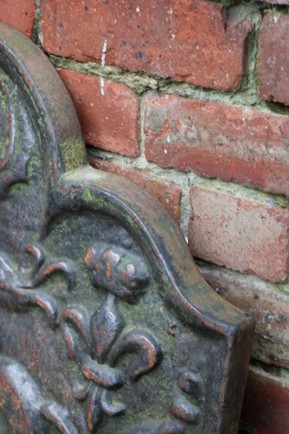 A cast iron fire back in the medieval style with passant guardant leopard. View VII