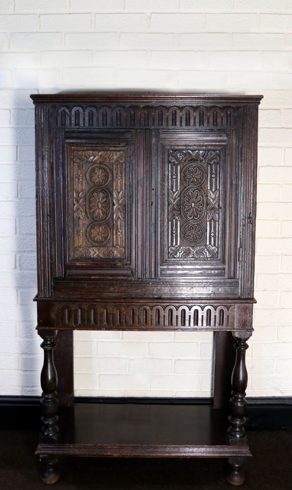 A lovely Victorian gothic revival cabinet on stand.
