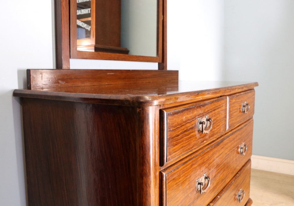 A dark mahogany Victorian dressing chest featuring a rectangular pivoting top mirror and four drawers with metal drop handles. View IX