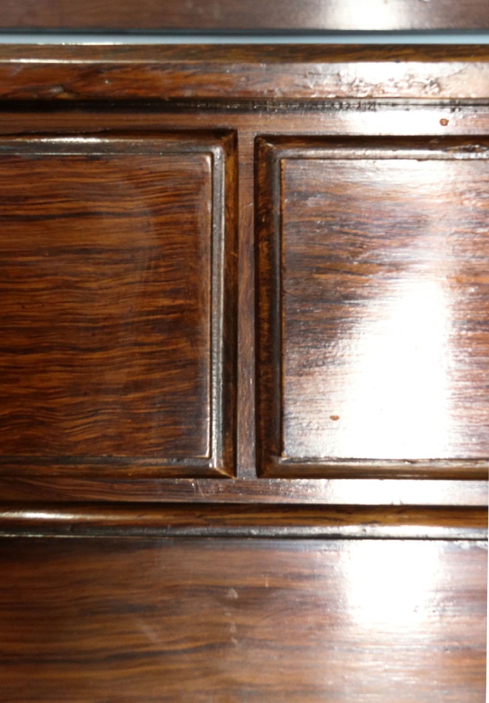 A dark mahogany Victorian dressing chest featuring a rectangular pivoting top mirror and four drawers with metal drop handles. View XIV