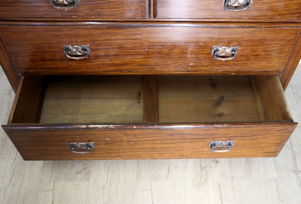 A dark mahogany Victorian dressing chest featuring a rectangular pivoting top mirror and four drawers with metal drop handles. View XVI