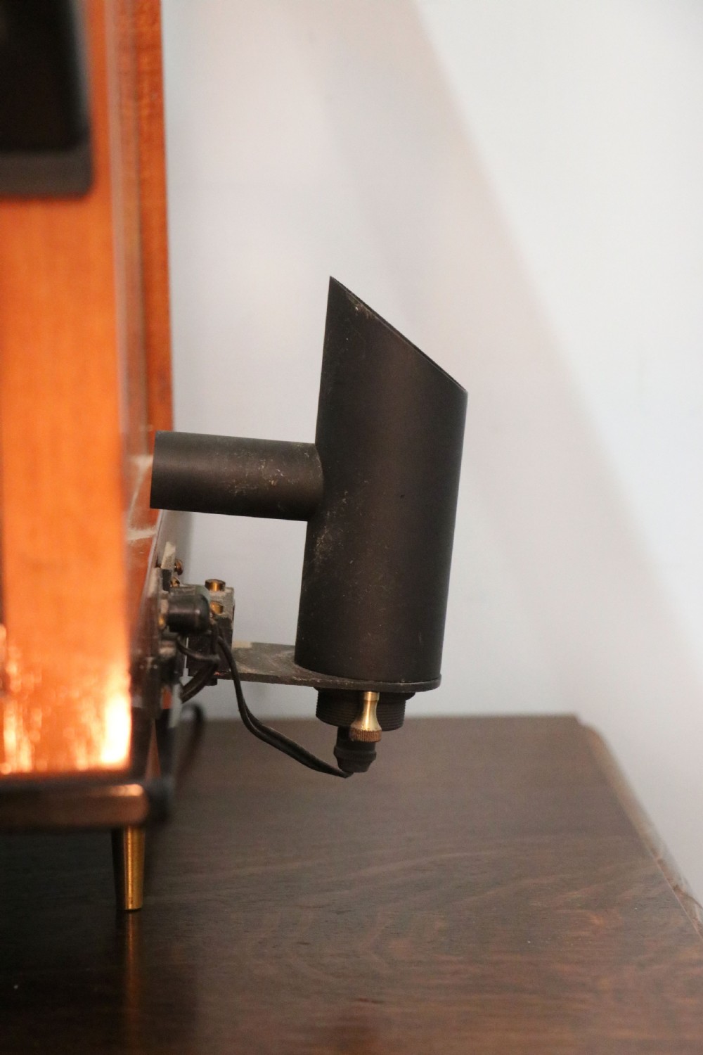 An Oertling precision chemists beam balance scale with a brass mechanism housed inside a glazed timber cabinet featuring gilded gold typography. View XIX