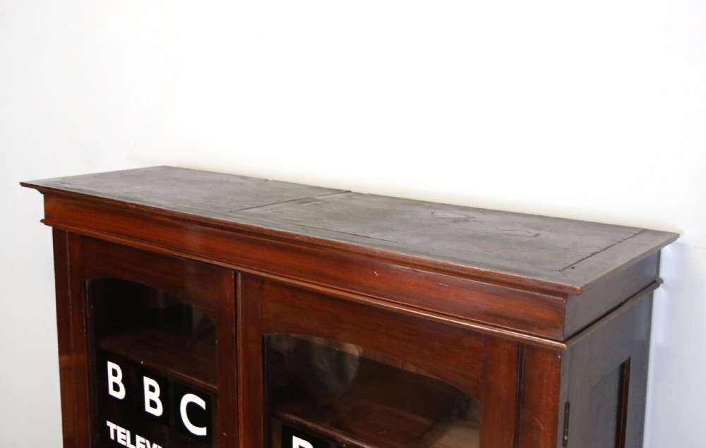  A lovely early 20th century mahogany framed glazed bookcase cabinet, later sign written for the (BBC) View VIII