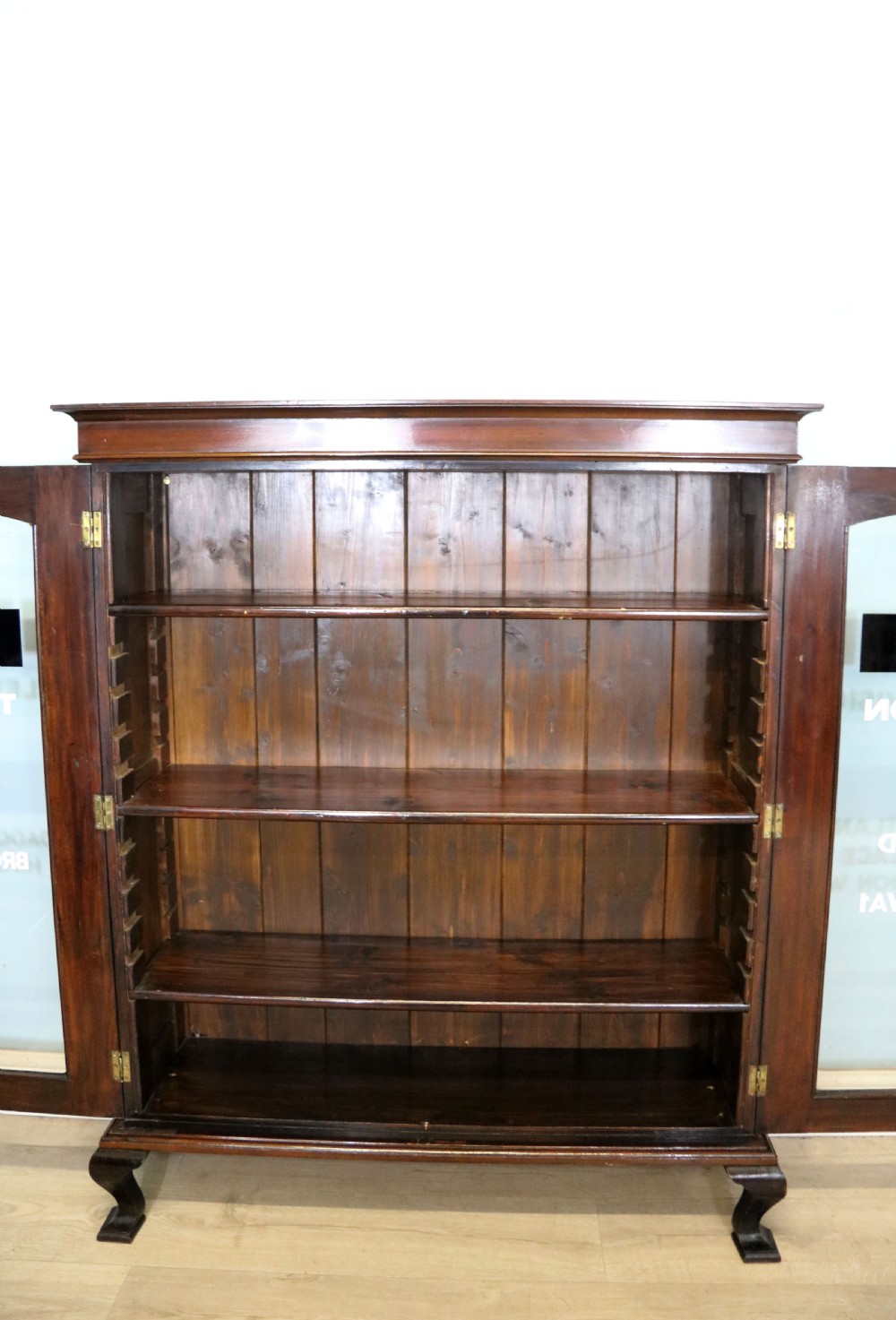  A lovely early 20th century mahogany framed glazed bookcase cabinet, later sign written for the (BBC) View XI