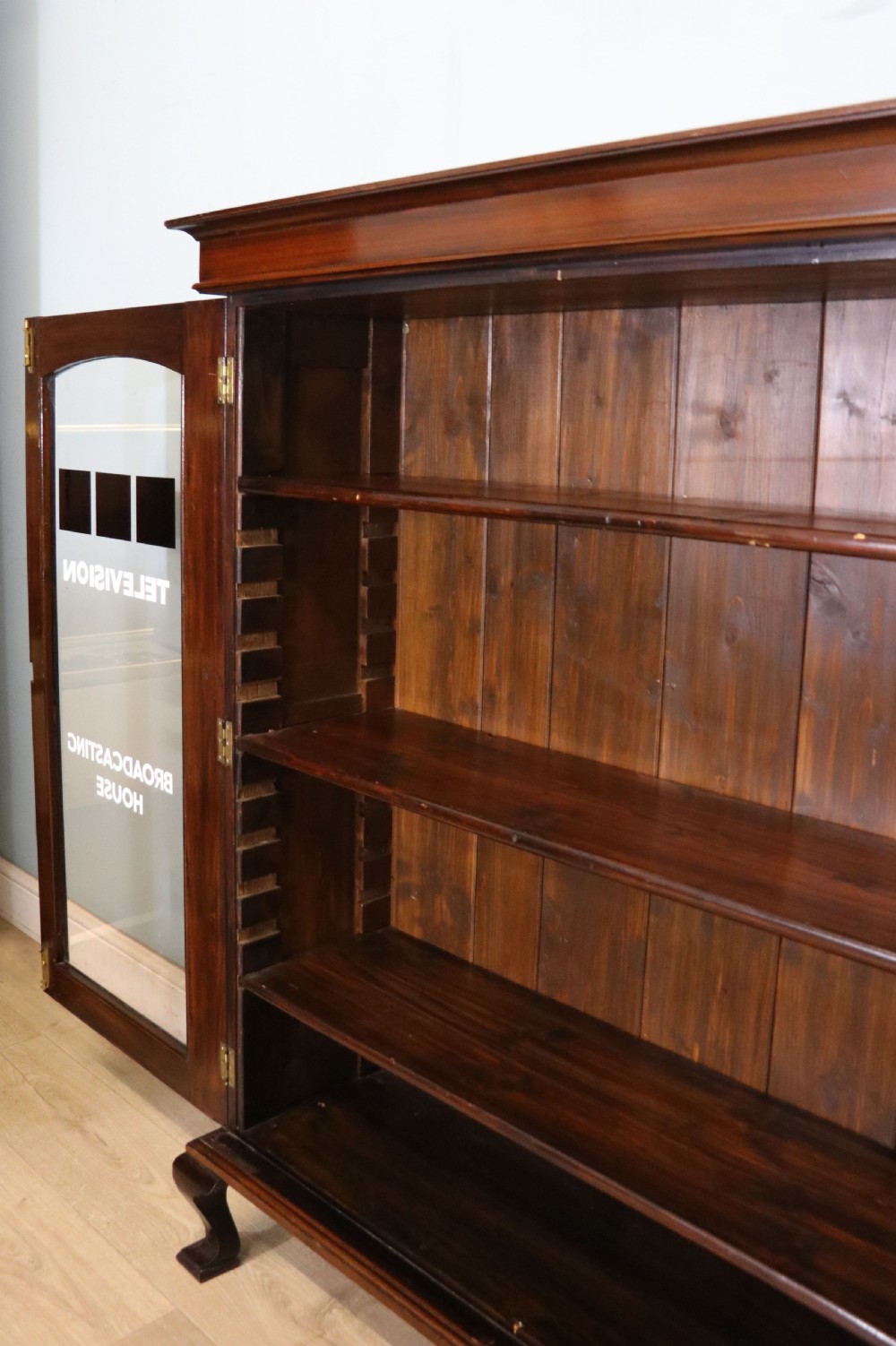  A lovely early 20th century mahogany framed glazed bookcase cabinet, later sign written for the (BBC) View XIII