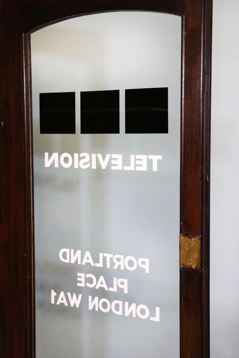  A lovely early 20th century mahogany framed glazed bookcase cabinet, later sign written for the (BBC) View XVII