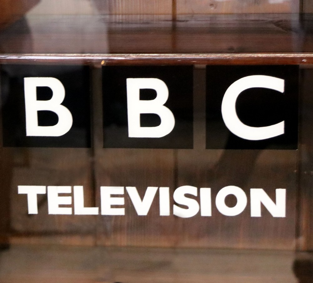  A lovely early 20th century mahogany framed glazed bookcase cabinet, later sign written for the (BBC) View XVIII