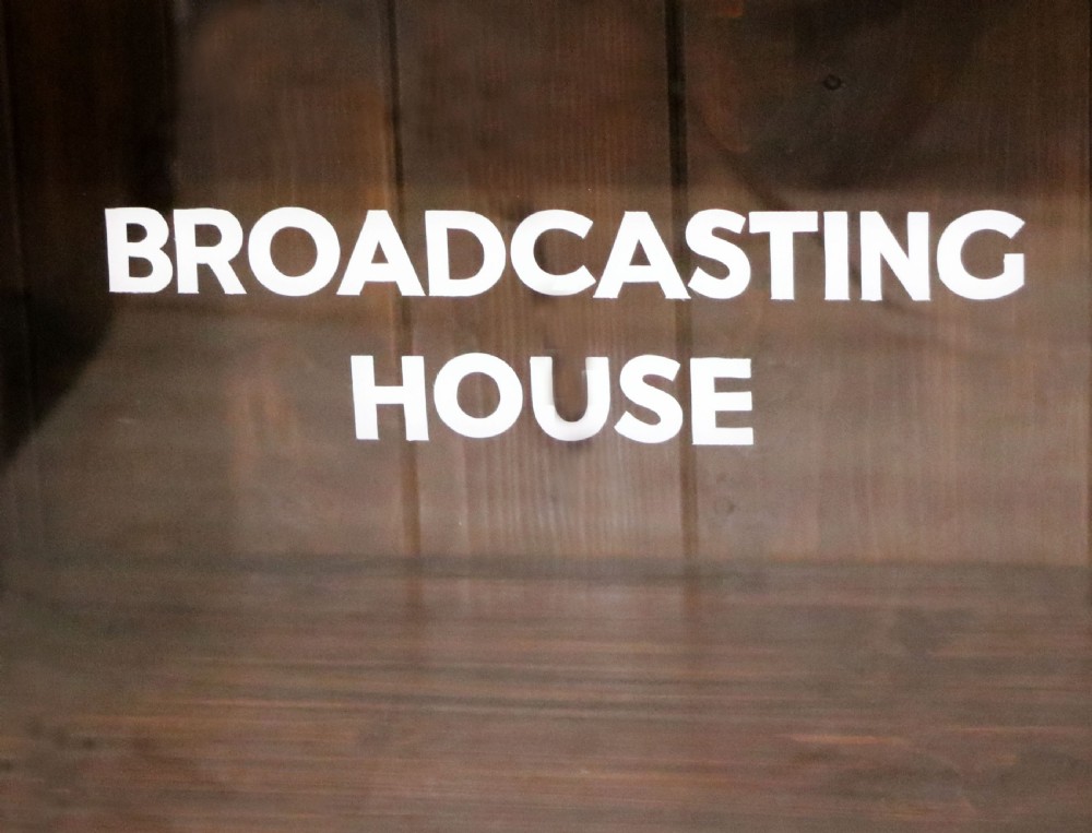  A lovely early 20th century mahogany framed glazed bookcase cabinet, later sign written for the (BBC) View XIX