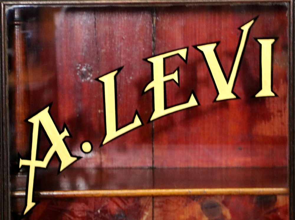 A quality mahogany shop display cabinet, later sign written for A.Levi  watch and clockmakers. View VI