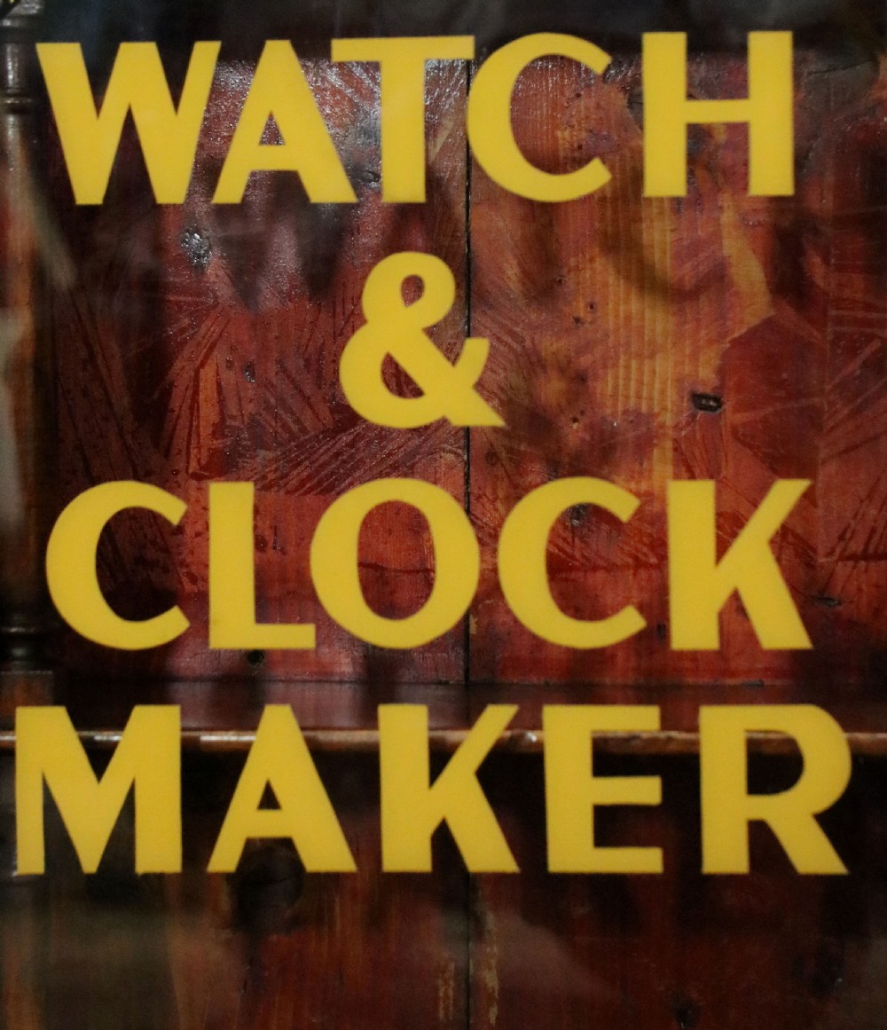 A quality mahogany shop display cabinet, later sign written for A.Levi  watch and clockmakers. View VII