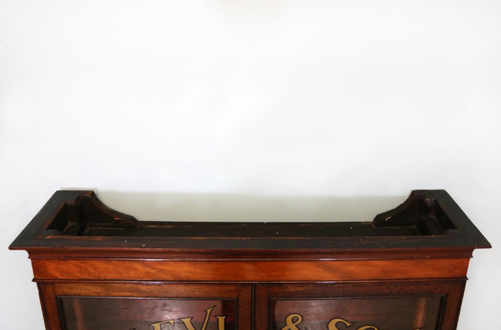 A quality mahogany shop display cabinet, later sign written for A.Levi  watch and clockmakers. View XIV