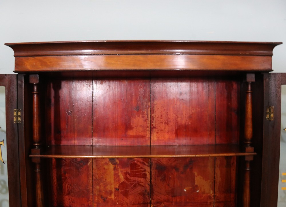 A quality mahogany shop display cabinet, later sign written for A.Levi  watch and clockmakers. View XXIV