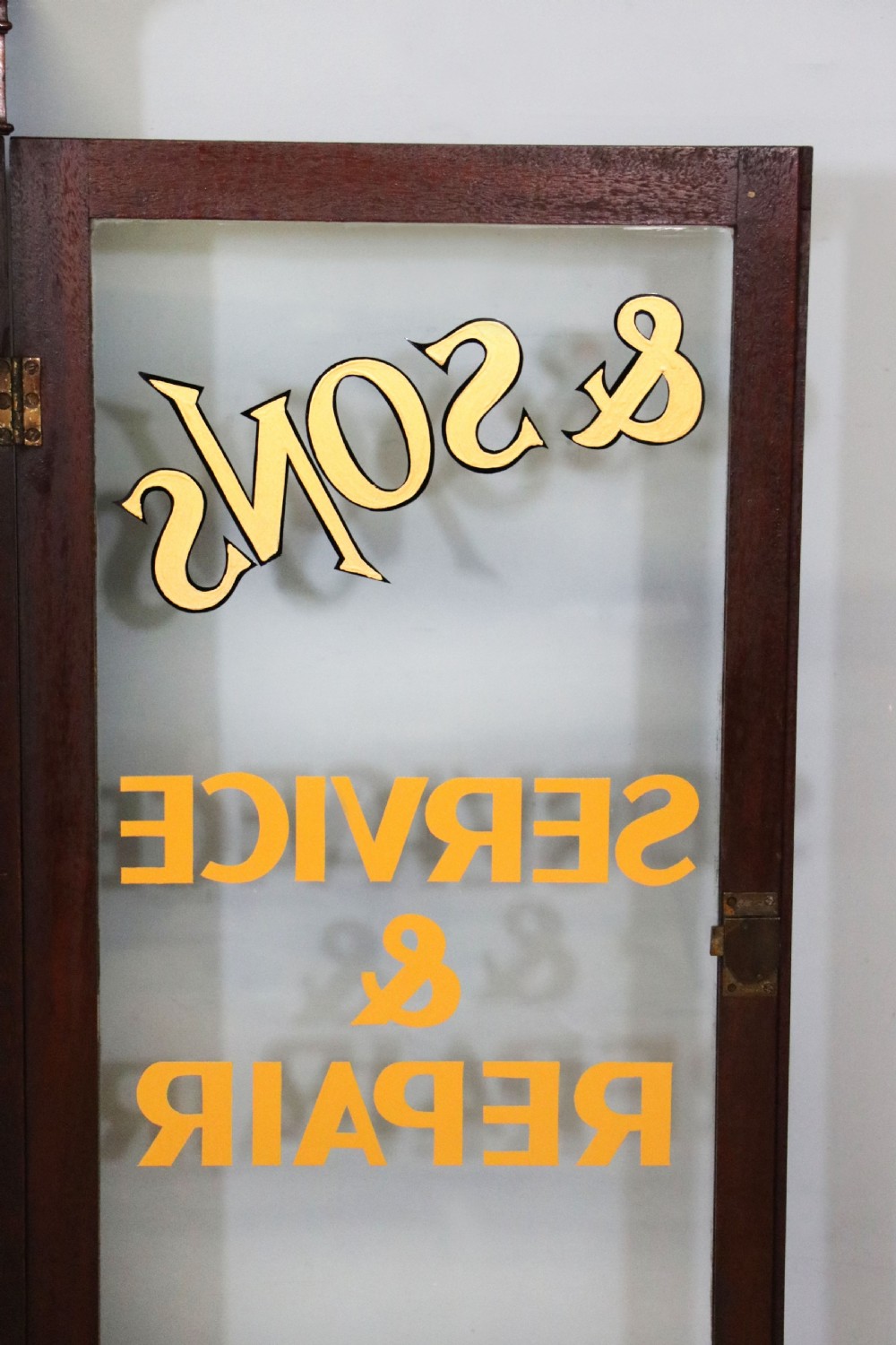 A quality mahogany shop display cabinet, later sign written for A.Levi  watch and clockmakers. View XXVII