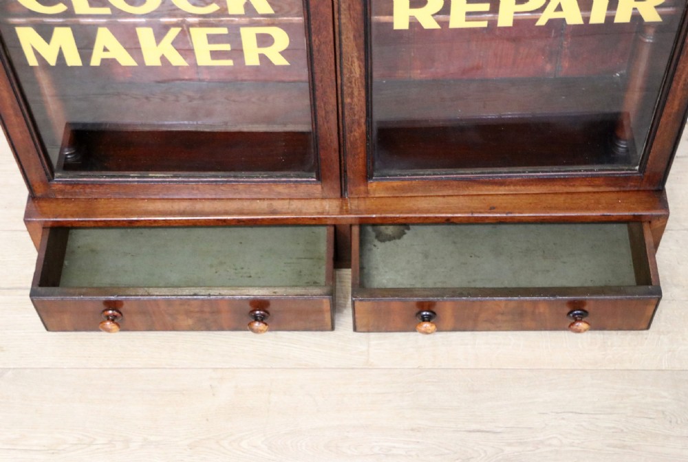 A quality mahogany shop display cabinet, later sign written for A.Levi  watch and clockmakers. View XXVIII