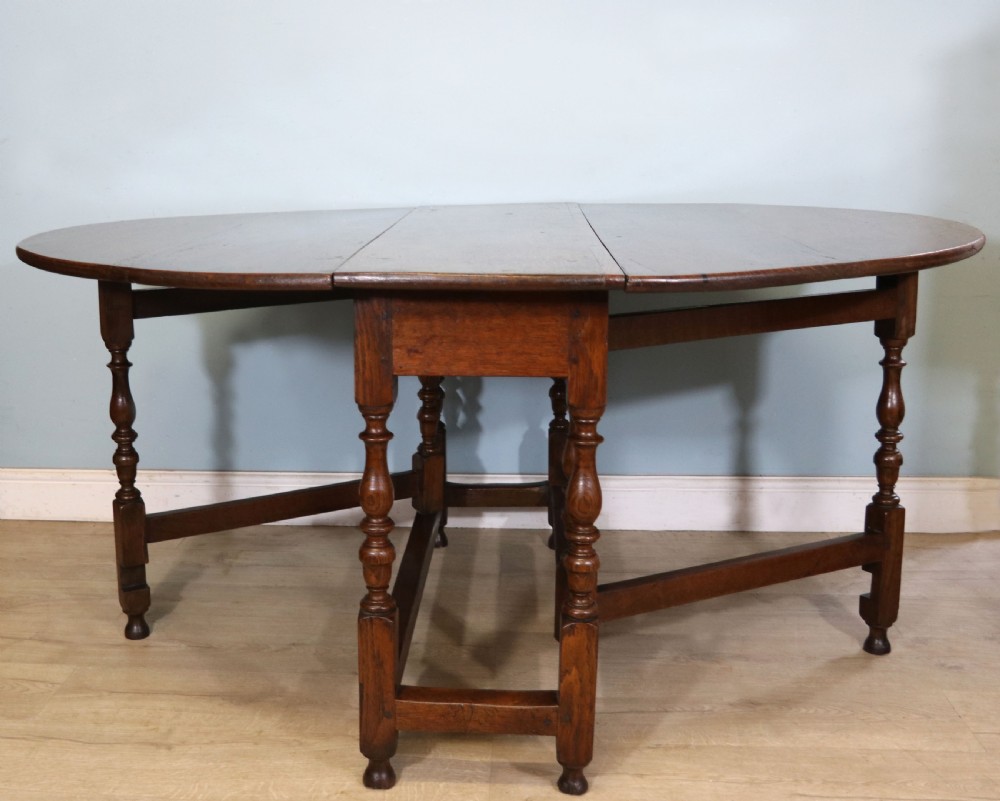  A beautiful 17th century style oval oak gateleg table. View II