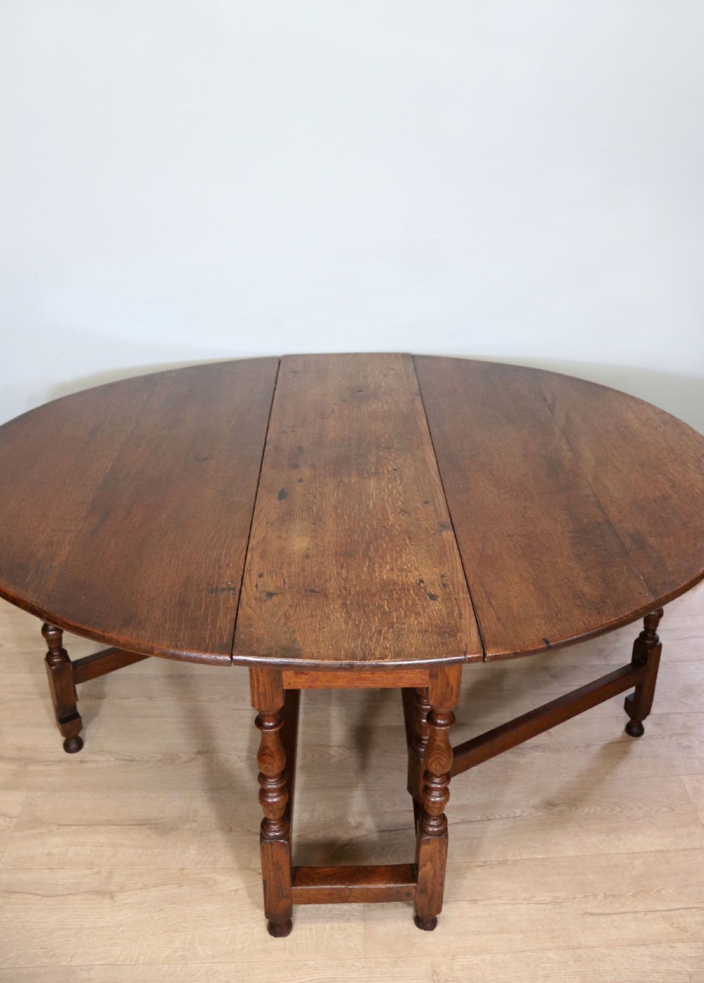  A beautiful 17th century style oval oak gateleg table. View III