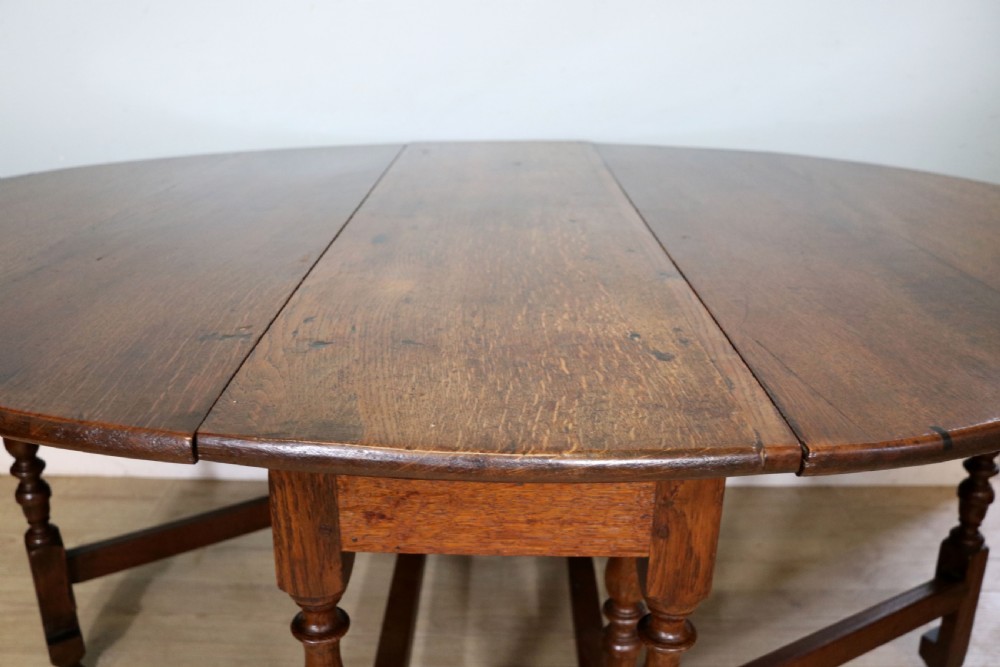  A beautiful 17th century style oval oak gateleg table. View X