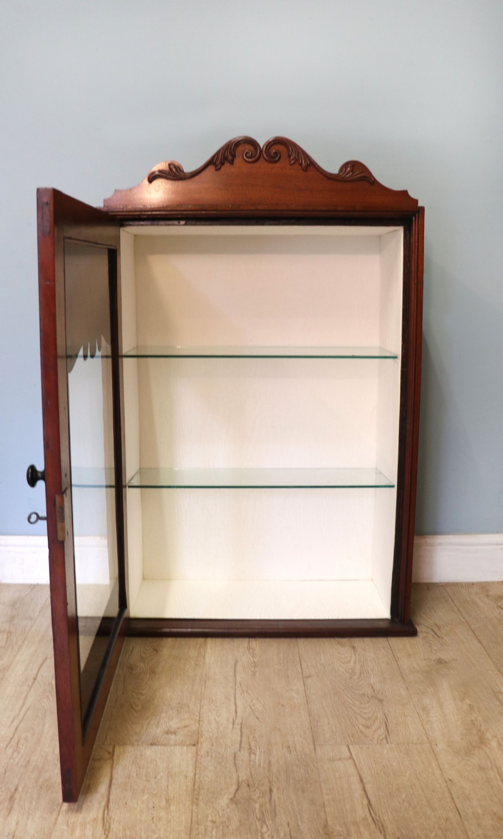 A lovely mahogany framed wall mounted display cabinet hand sign written for Cadburys Chocolate View III