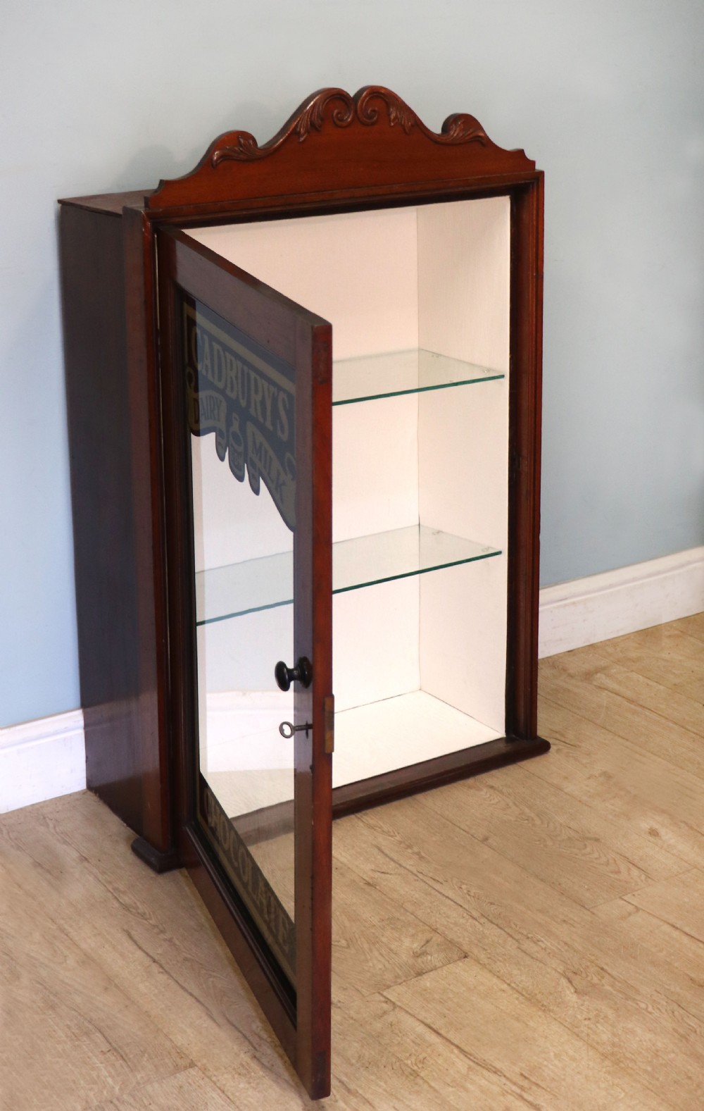 A lovely mahogany framed wall mounted display cabinet hand sign written for Cadburys Chocolate View IV