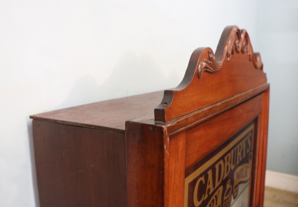 A lovely mahogany framed wall mounted display cabinet hand sign written for Cadburys Chocolate View VIII