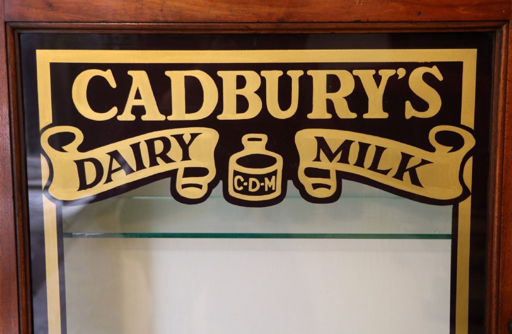 A lovely mahogany framed wall mounted display cabinet hand sign written for Cadburys Chocolate View IX