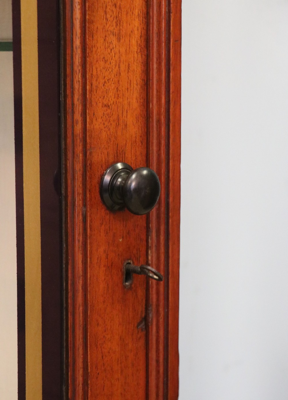 A lovely mahogany framed wall mounted display cabinet hand sign written for Cadburys Chocolate View XII